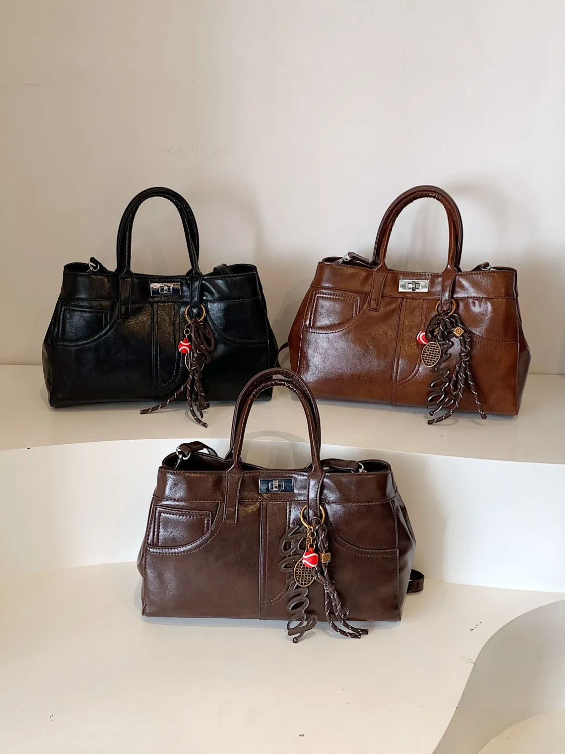 Luxe Charm PU Leather Handbag – With Signature Pendant