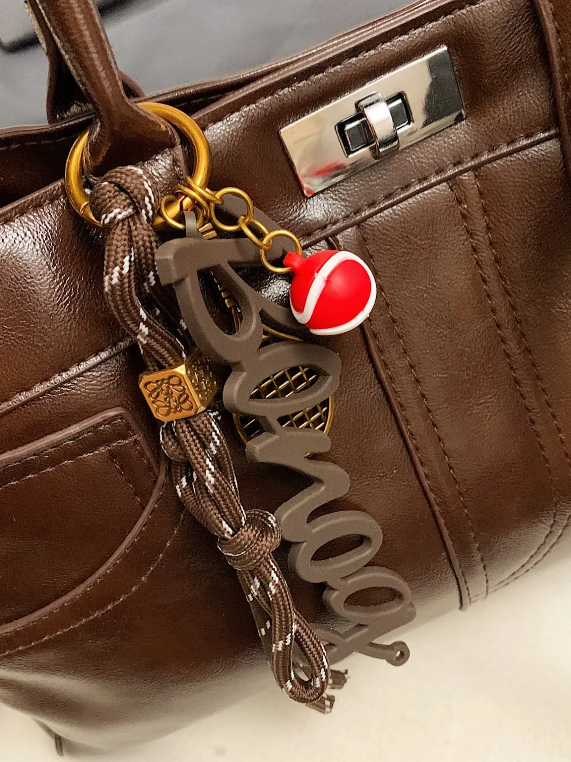 Luxe Charm PU Leather Handbag – With Signature Pendant