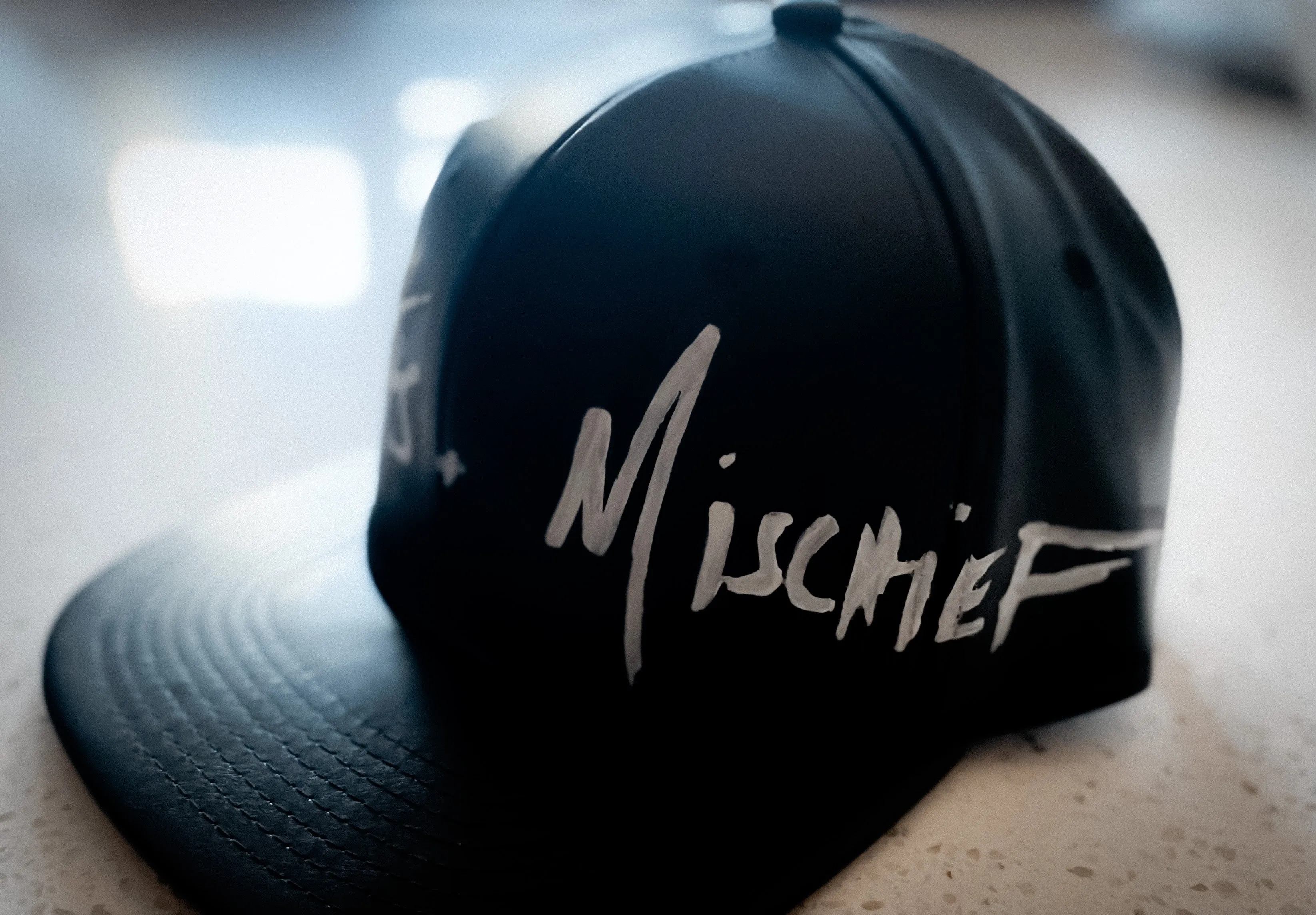Misfits & Mischief Logo Hat Style 2: Front Painted Faux Leather Hat