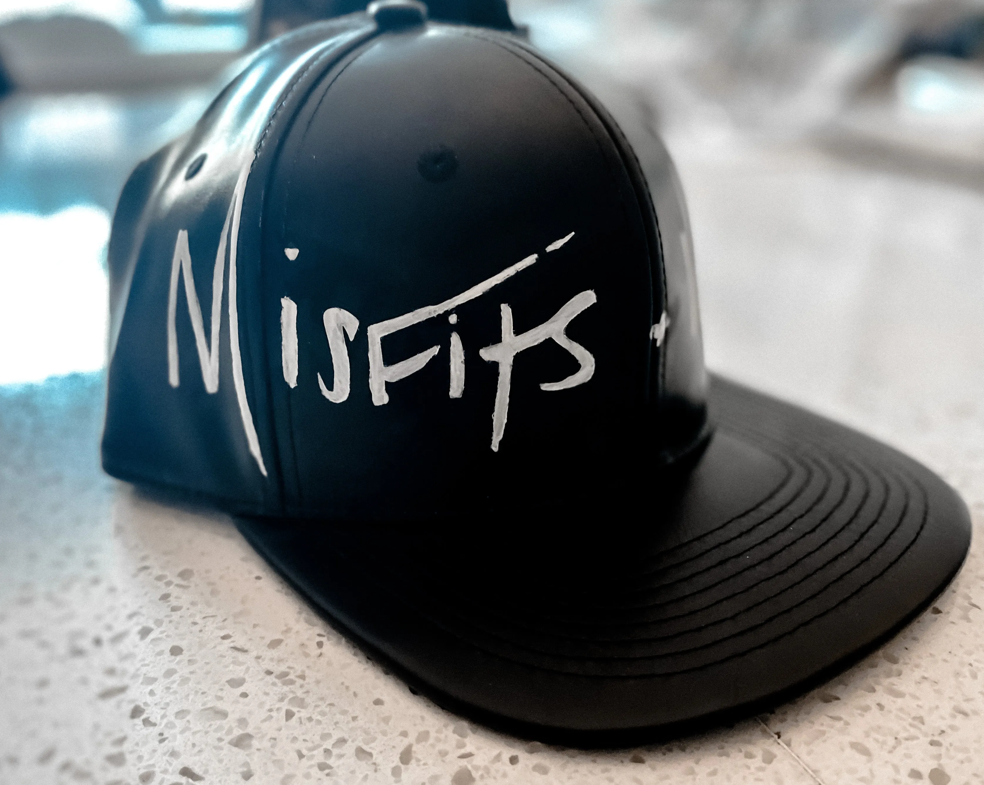 Misfits & Mischief Logo Hat Style 2: Front Painted Faux Leather Hat