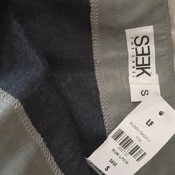 SEEK THE LABEL LF ASSYMETRICAL ZIP MINI SKIRT