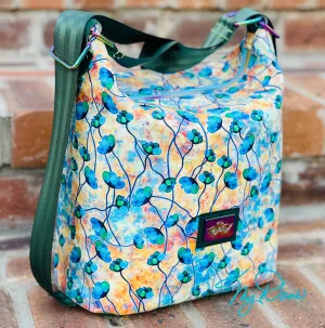The Krystal Convertible Mini Handbag in Blue and Copper Floral