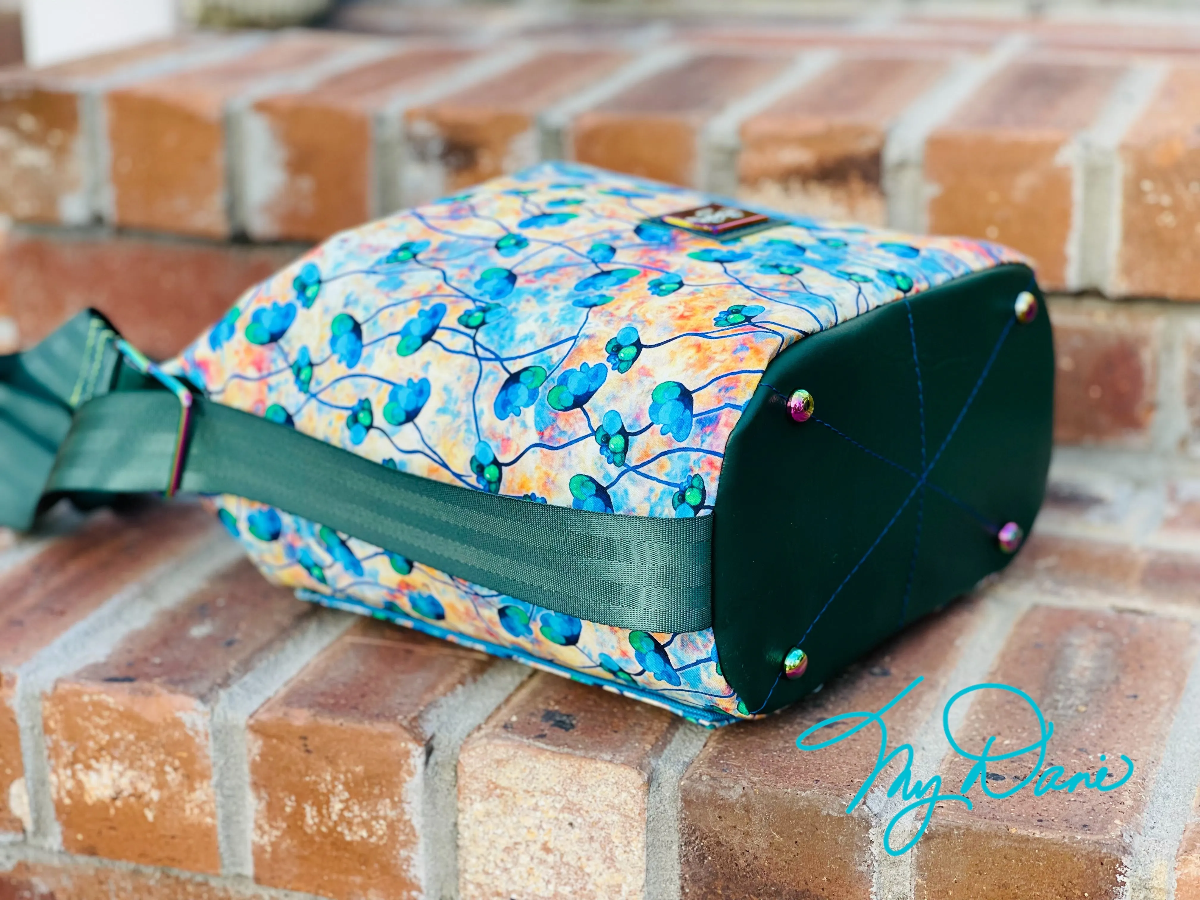 The Krystal Convertible Mini Handbag in Blue and Copper Floral