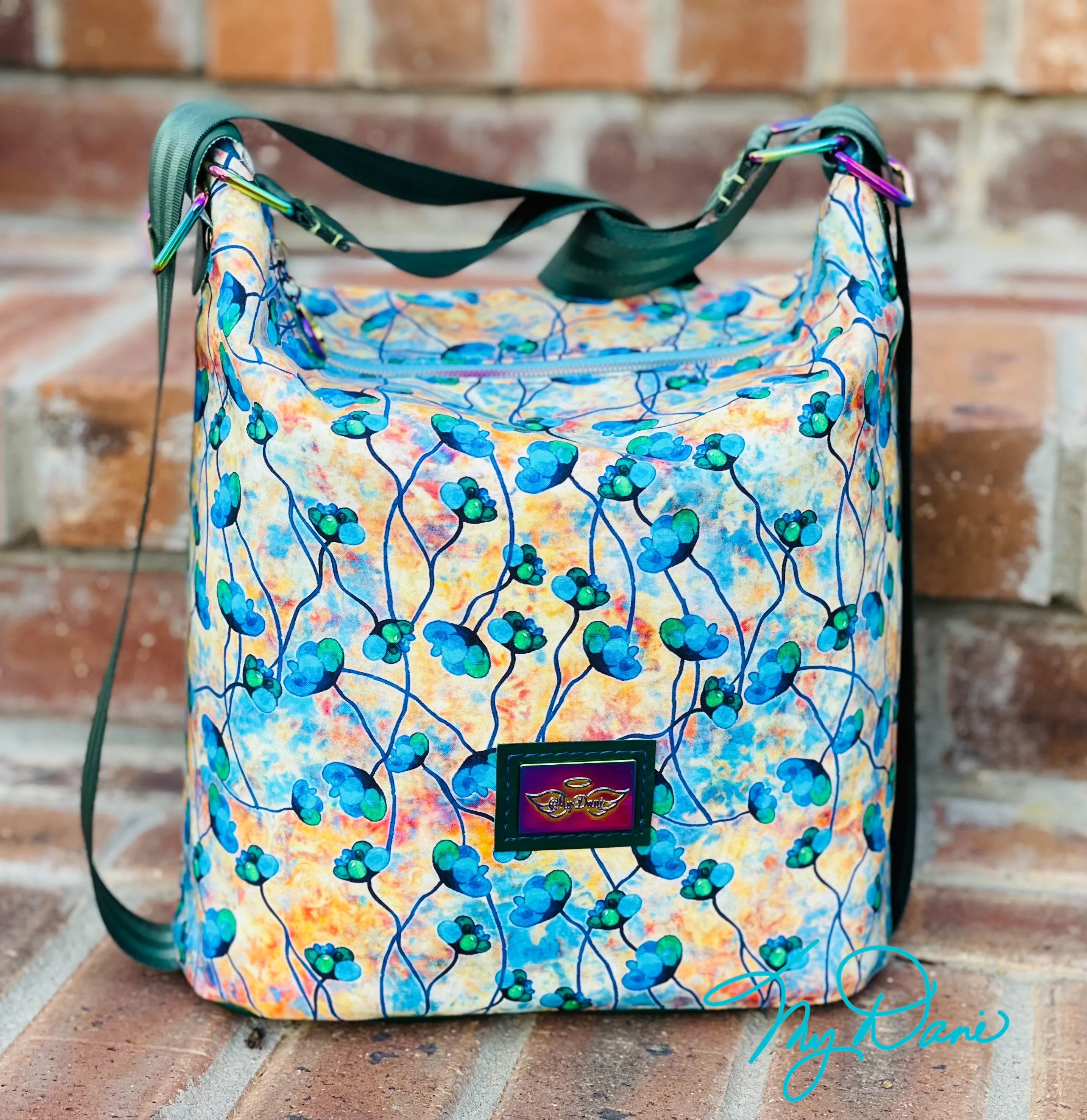 The Krystal Convertible Mini Handbag in Blue and Copper Floral