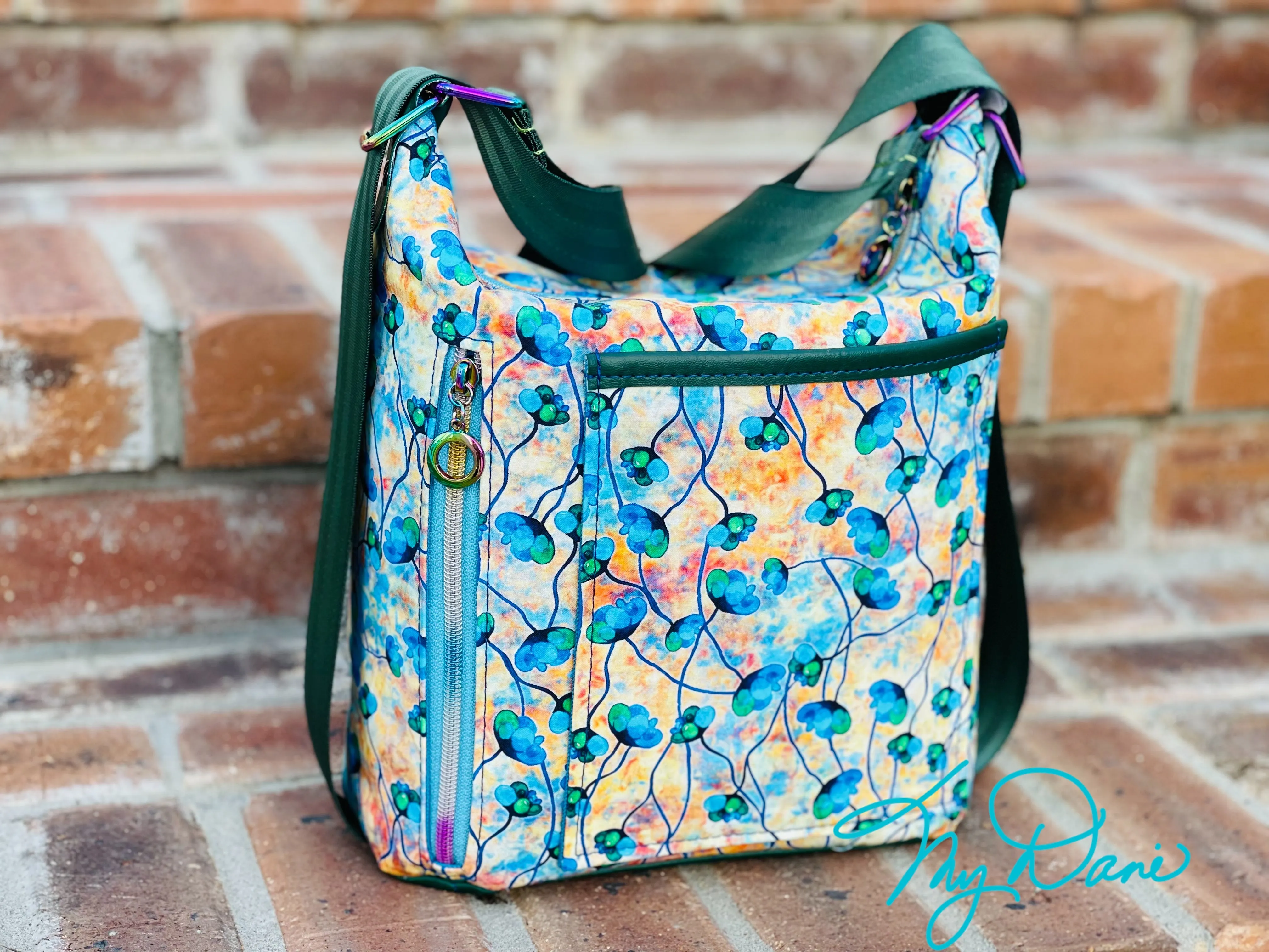 The Krystal Convertible Mini Handbag in Blue and Copper Floral